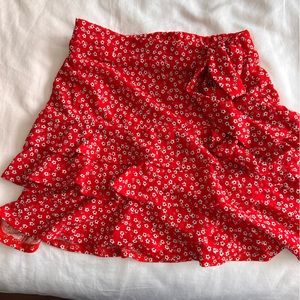 Red ruffle mini skirt with an attached belt